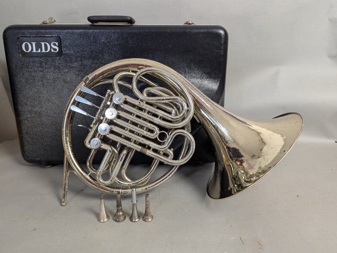 Vintage Olds Double French Horn with Case and Mouthpieces: **Important** Please read below description on how to avoid high shipping costs. Don't miss this opportunity to own a vintage Olds double French horn set. This collection includes a horn with some vis
