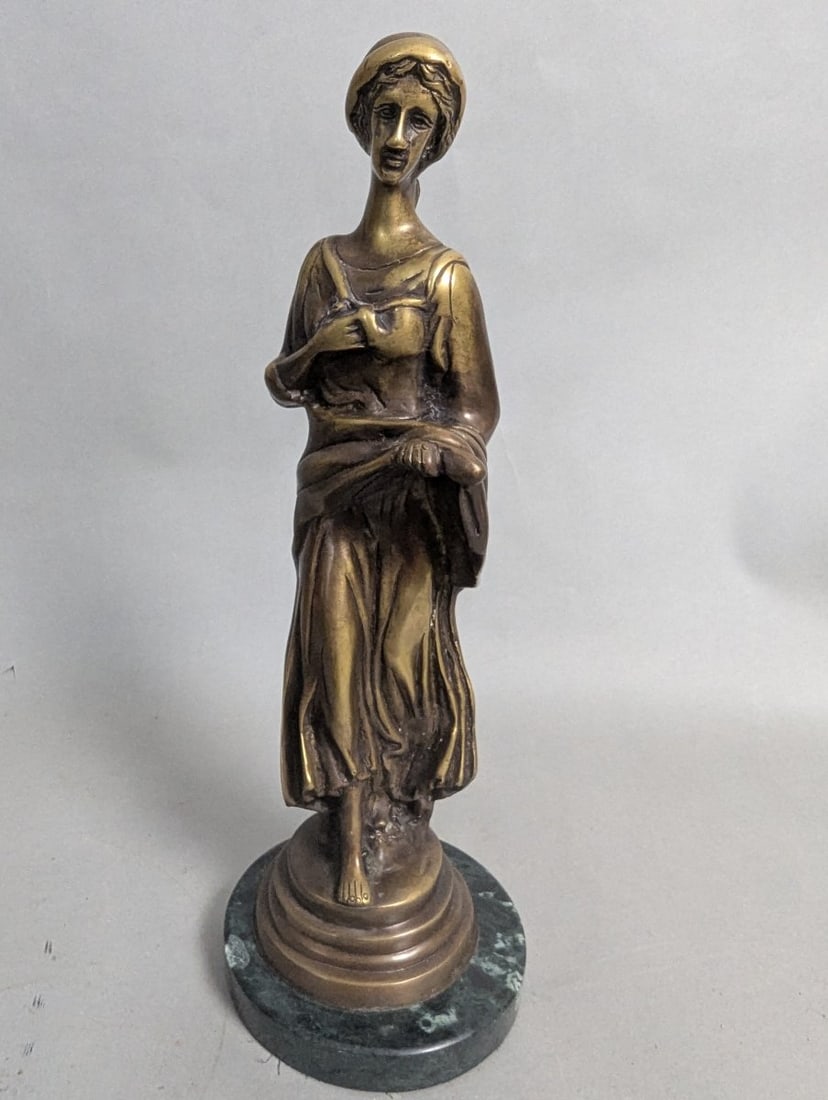 Stunning Bronze Female Sculpture on Elegant Marble Base: **Important** Please read below description on how to avoid high shipping costs. This exquisite bronze female sculpture stands 14 high with a 5 1/4 diameter marble base. Despite a distinct chip on the