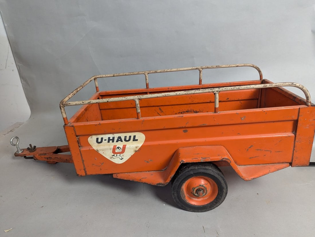 Vintage U-Haul Pressed Steel Pedal Car Trailer: **Important** Please read below description on how to avoid high shipping costs. This authentic vintage Hamilton U-Haul pressed steel trailer measures 12 high x 37 x 18 inches. It features newer eye