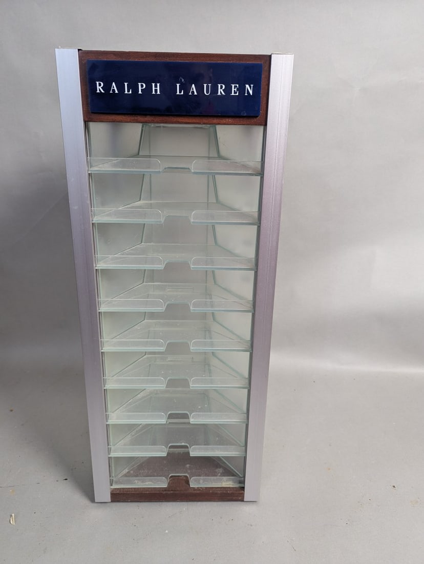 Ralph Lauren Eyewear Display Case Rotating Countertop Stylish Showcase: **Important** Please read below description on how to avoid high shipping costs. Elevate your space with this Ralph Lauren Eyewear Display Case, a true piece of retail history! Measuring 26 high x