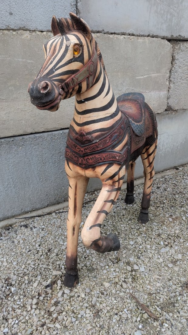 Large Hand-Carved Painted Wooden Carousel Zebra Sculpture: **Important** Please read below description on how to avoid high shipping costs. Discover a stunning large wooden zebra sculpture, measuring 51 high x 12 x 43. This unique piece is hand-carved and