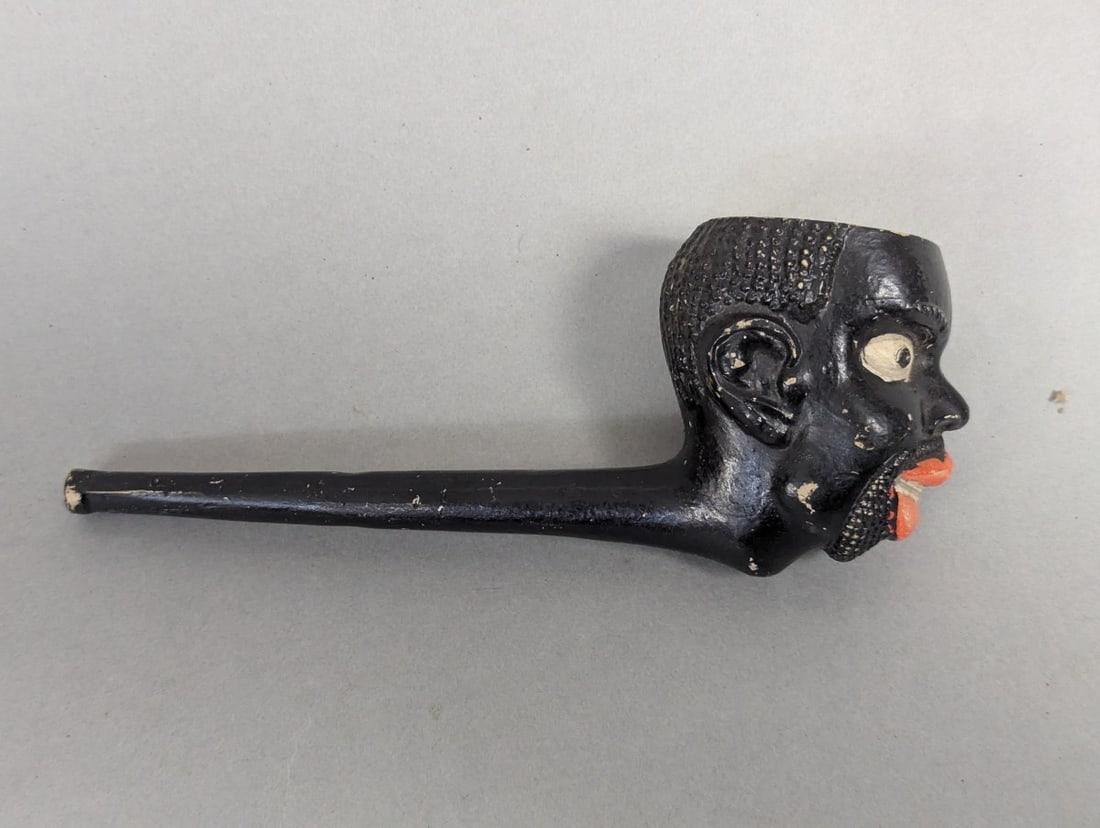 Rare 19th Century Painted Blackamoor Nubian Clay Pipe Collectible: **Important** Please read below description on how to avoid high shipping costs. Discover a RARE 19TH CENTURY PAINTED BLACKAMOOR NUBIAN CLAY PIPE, measuring 7 x 2 x 3 inches. This exquisite piece, cra