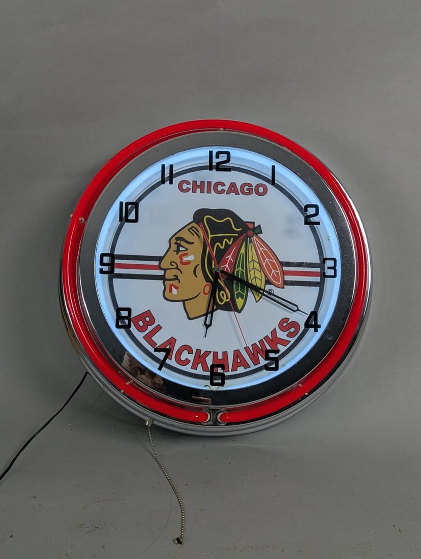Chicago Blackhawks Neon Wall Clock for Game Room or Bar: **Important** Please read below description on how to avoid high shipping costs. Enhance your space with this stylish Chicago Blackhawks Neon Wall Clock! Clock and neon work fine. 5 deep x 19 diameter