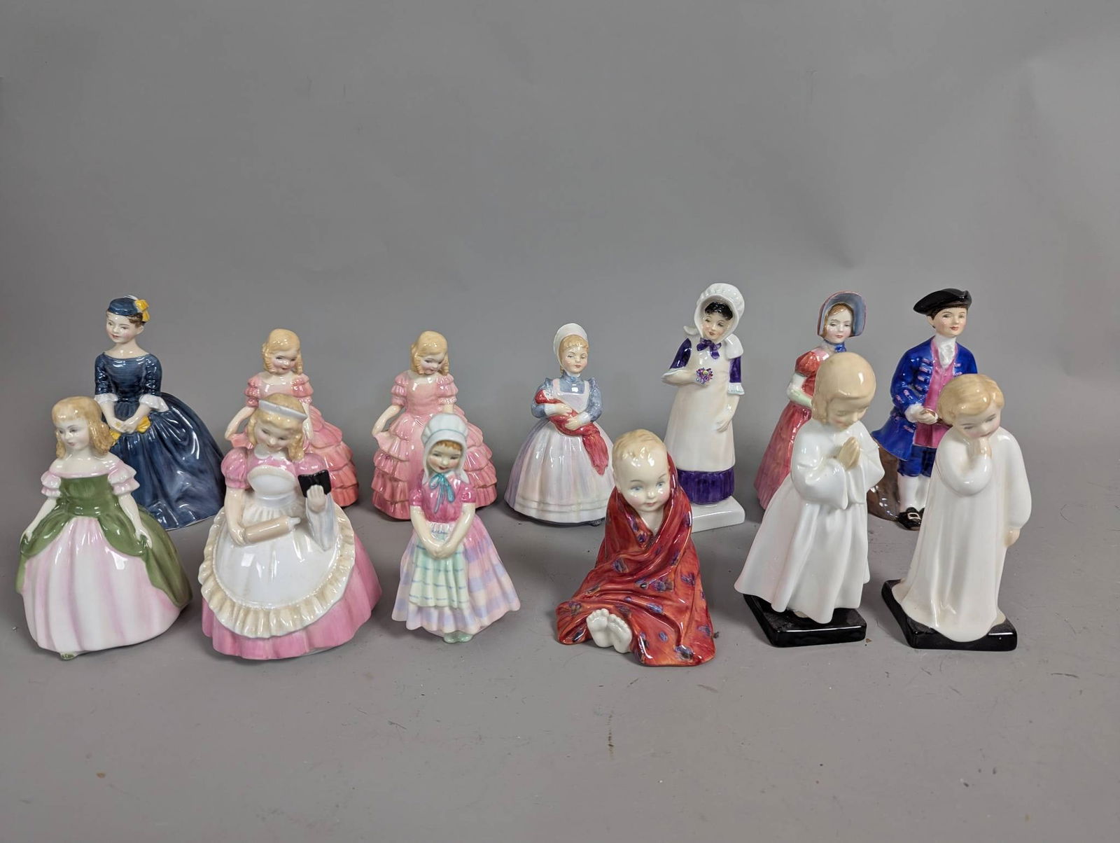 Royal Doulton Porcelain Figurines Depicting Various Characters: **Important** Please read below description on how to avoid high shipping costs. Royal Doulton porcelain figurines featuring various characters in detailed attire. Included are pieces such as Anna