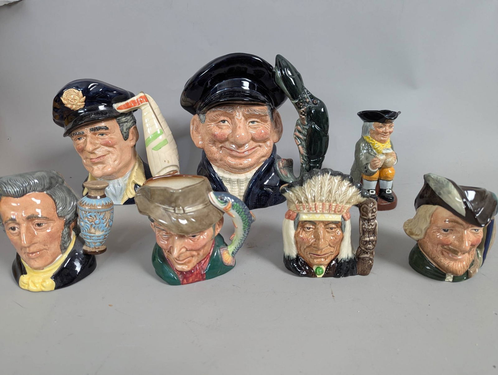 Royal Doulton Character Jugs Representing Various Figures: **Important** Please read below description on how to avoid high shipping costs. Royal Doulton character jugs, crafted in fine ceramic and hand-painted. Makers' marks, designs, and copyrights identify