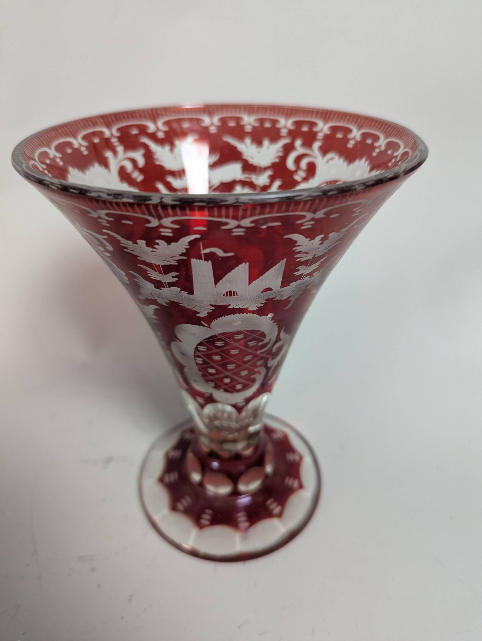 Vintage Bohemian Ruby Cut-to-Clear Glass Vase with Ornate Designs: **Important** Please read below description on how to avoid high shipping costs. Vintage Bohemian ruby cut-to-clear glass vase, believed to be from the Egermann factory in Czechoslovakia. Measures 7 h