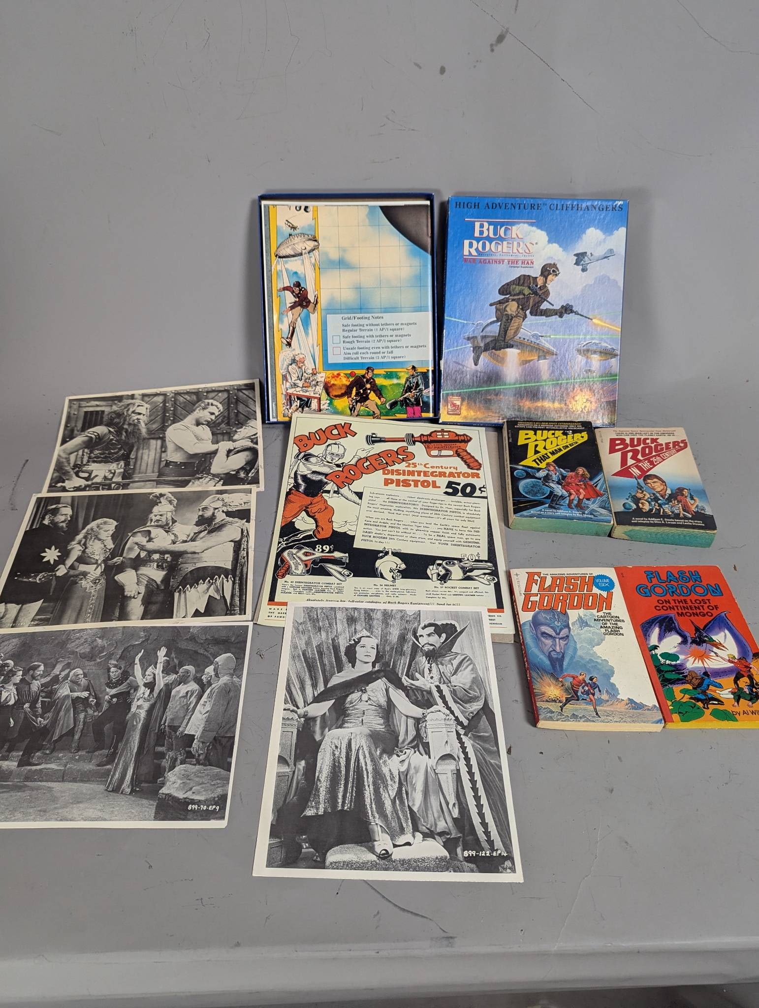Buck Rogers and Flash Gordon Memorabilia: **Important** Please read below description on how to avoid high shipping costs. Buck Rogers and Flash Gordon memorabilia featuring various items, including a Buck Rogers High Adventure Cliffhanger