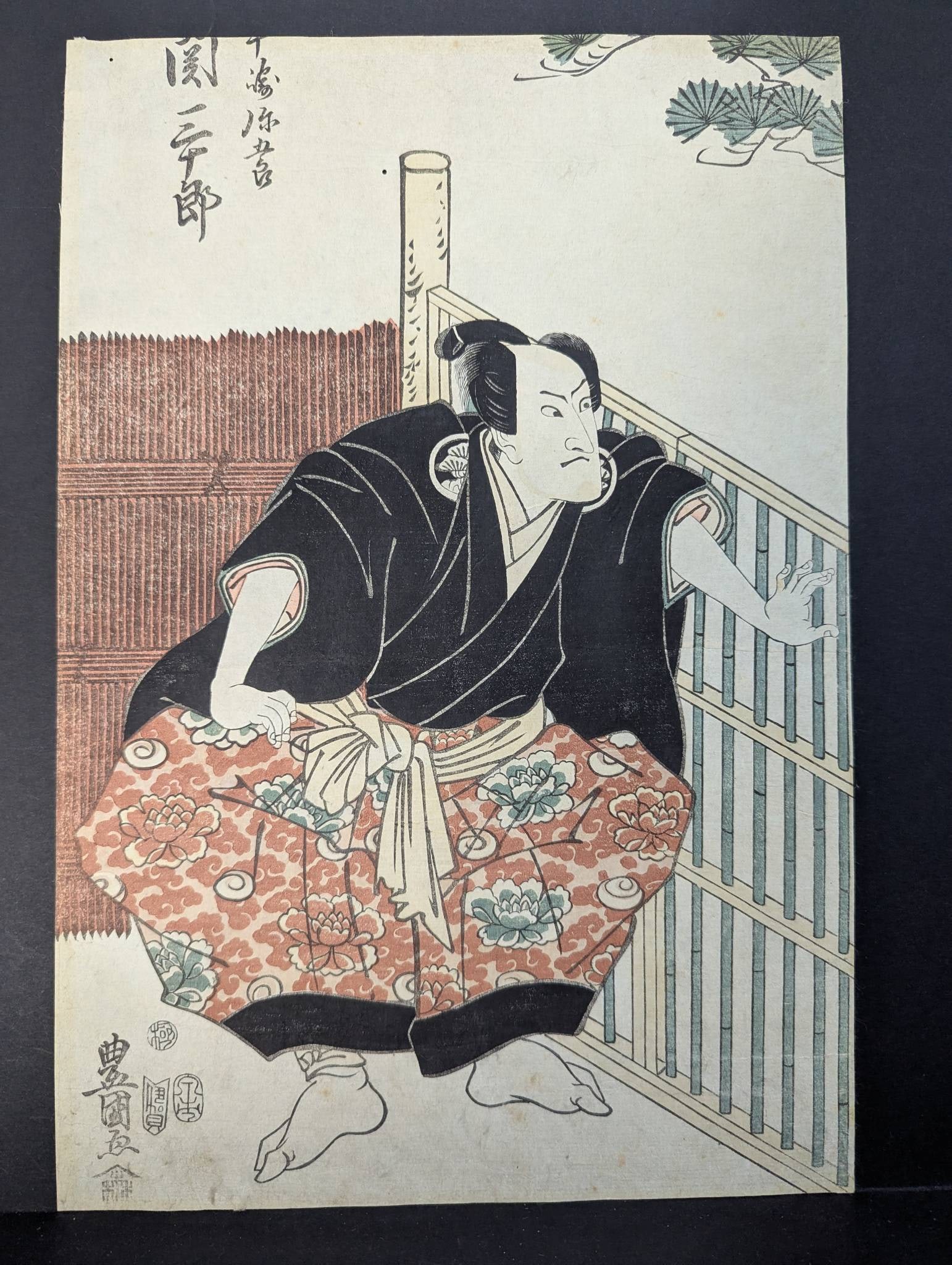 Japanese Woodblock Print by Toyokuni Man by Fence, Original 19th Century: **Important** Please read below description on how to avoid high shipping costs. Original 19th-century Japanese woodblock print by Toyokuni depicting a man seated by a fence. Dimensions are 9 3/4