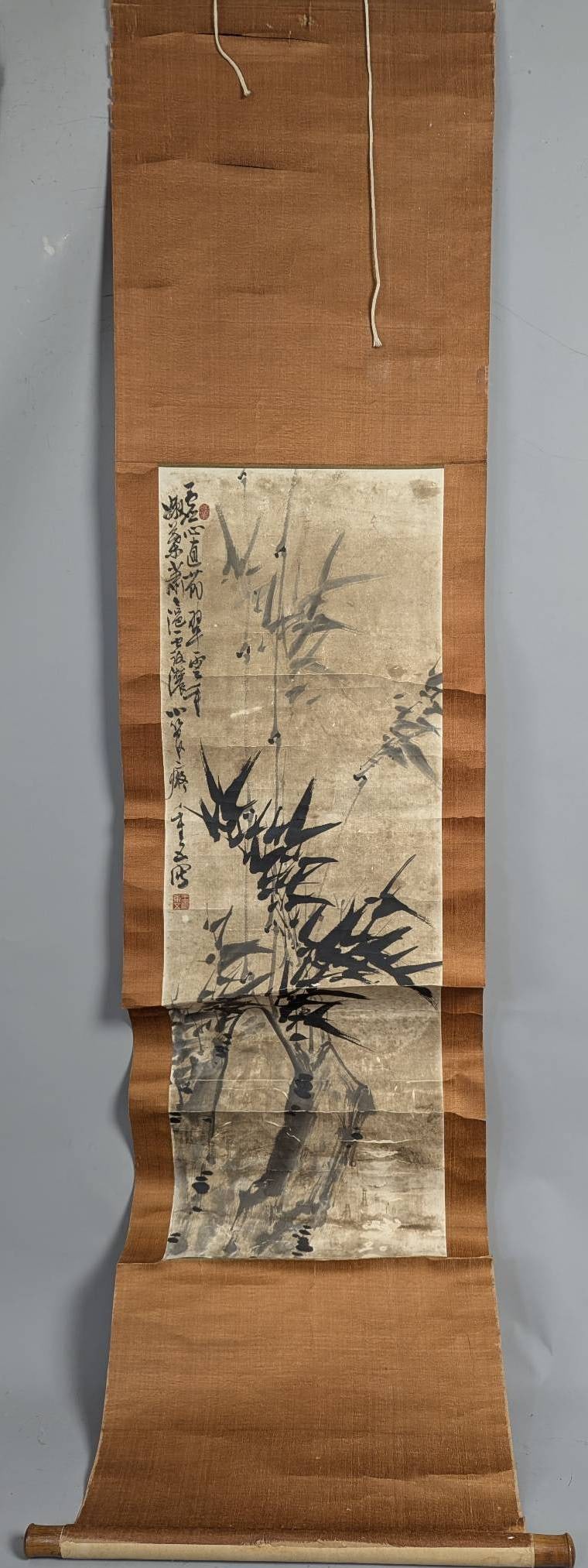 Japanese Floral Scroll Painting with Calligraphy and Bamboo Motif: **Important** Please read below description on how to avoid high shipping costs. Japanese floral scroll painting featuring a bamboo motif, accompanied by calligraphy along the left margin. The