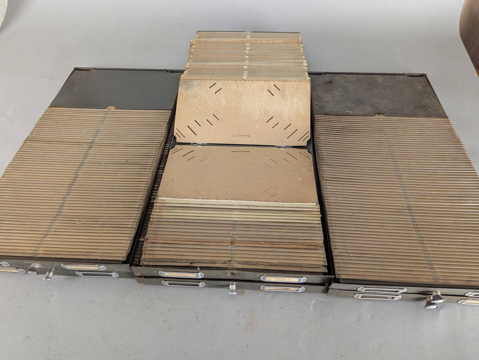 Set of 6 Antique Army Green Metal File Drawers: **Important** Please read below description on how to avoid high shipping costs. Six metal file drawers in army green color. Each drawer measures 22 1/2 inches long by 12 inches wide by 1 inch deep.