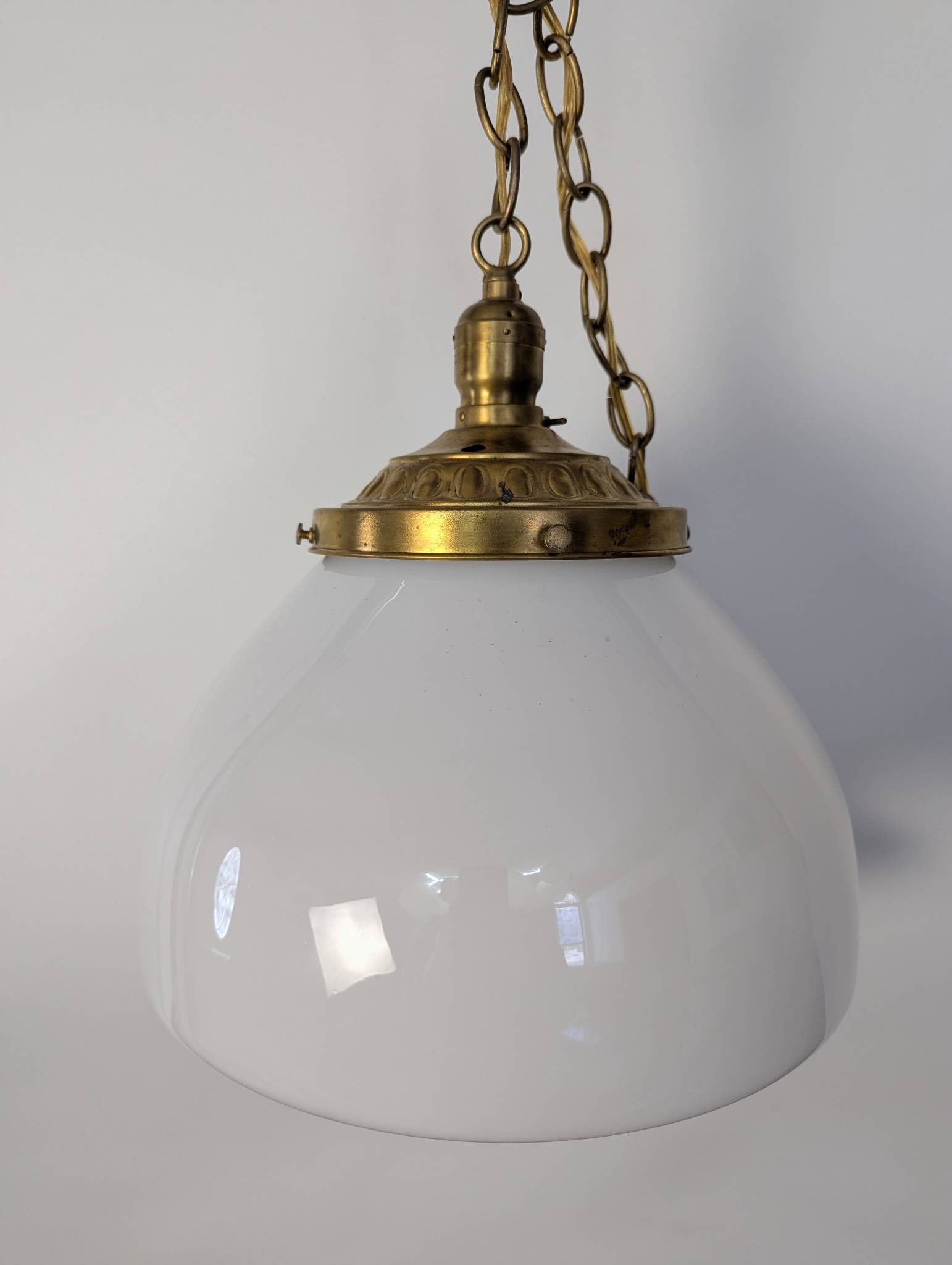 Opaline Glass Pendant Light with Brass Fitter and Chain in Vintage Style Art Deco: **Important** Please read below description on how to avoid high shipping costs. Opaline or milk glass pendant light featuring a white glass shade paired with a brass fitter and chain. The piece is 12