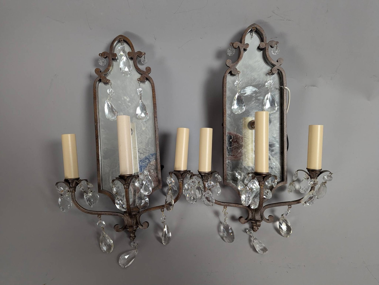 Early 20th-Century Italian Baroque Style Mirrored Wall Sconces: **Important** Please read below description on how to avoid high shipping costs. Early 20th-century Italian mirrored wall sconces crafted in a Baroque style, featuring delicate cut crystals. Each scon