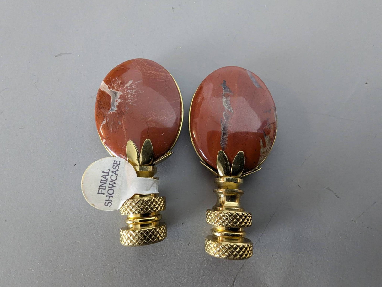 Brecciated Jasper Stone Lamp Finials with Polished Brass Base: **Important** Please read below description on how to avoid high shipping costs. 2 Brecciated Jasper stone lamp finials featuring polished, semi-precious oval stones mounted on solid brass bases.