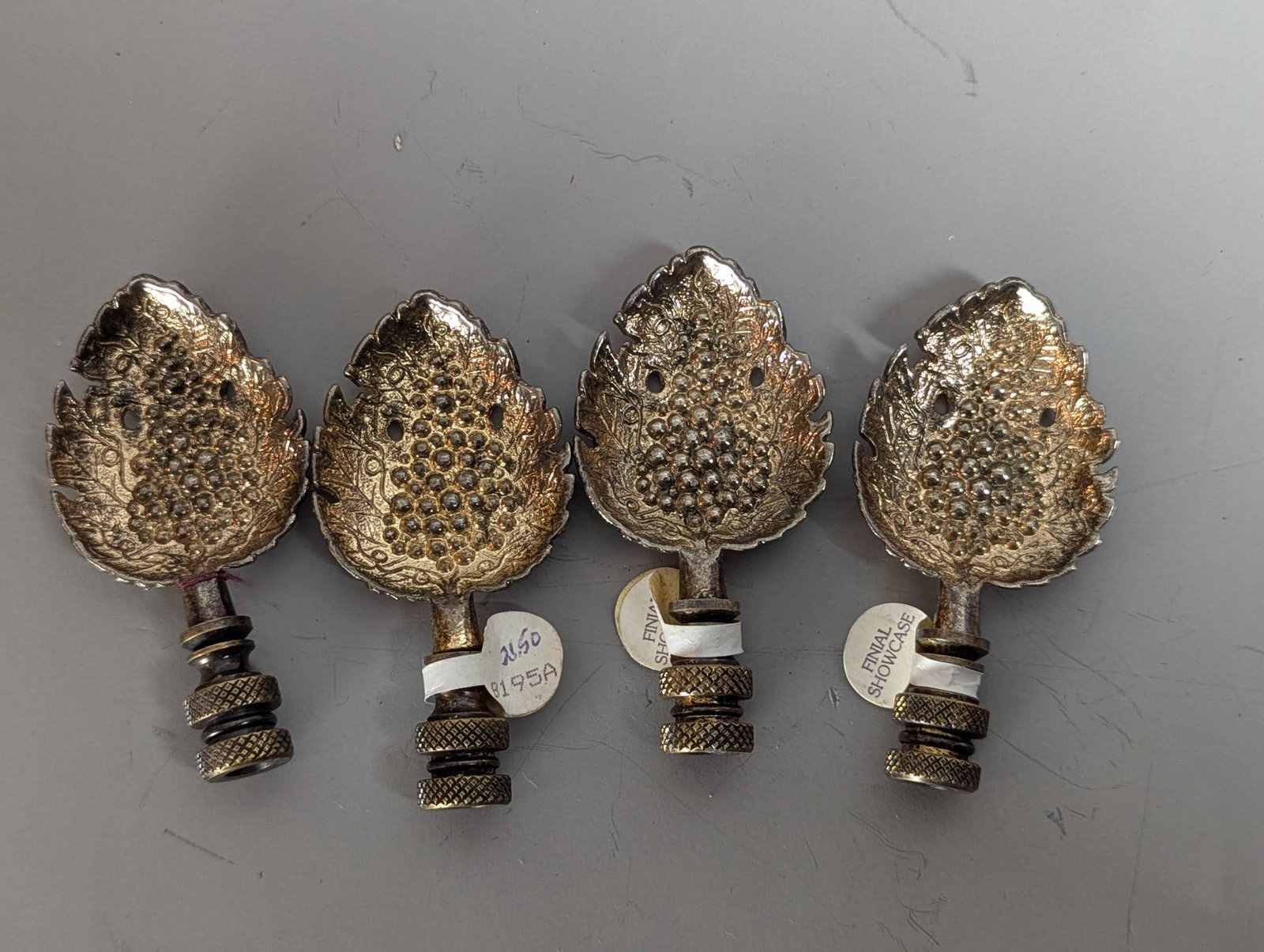 4 Silver Plate Sculptural Lamp Finials with Brass Bases: **Important** Please read below description on how to avoid high shipping costs. Four silver-plated sculptural lamp finials featuring a textured and leaf-inspired design. Each finial measures