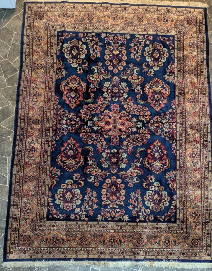 Exclusive Machine-Made Persian-Style Area Rug Floral Design Deep Blue Rust Beige: **Important** Please read below description on how to avoid high shipping costs. This stunning machine-made Persian-style area rug features a captivating floral design in deep blue, rust, and beige