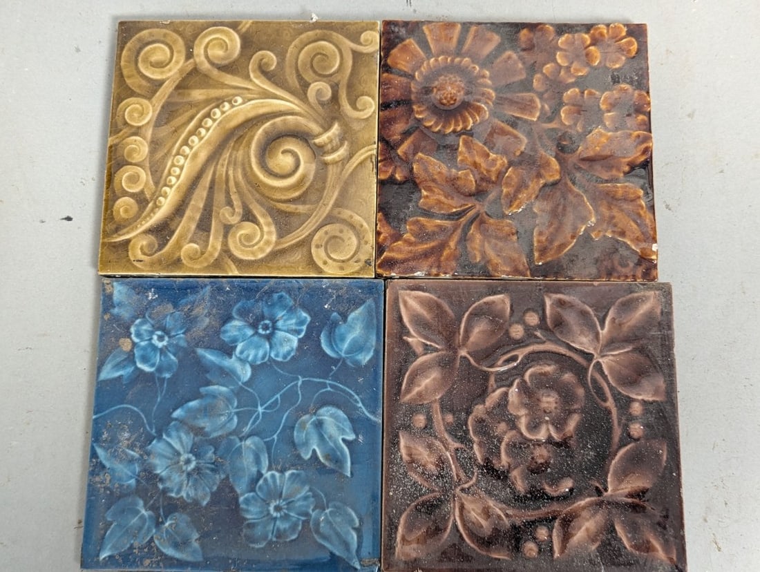 Collection of 4 Antique Ceramic Tiles Art Nouveau Floral Blue Ochre Majolica Glazed: **Important** Please read below description on how to avoid high shipping costs. Discover a captivating collection of four distinct antique ceramic tiles, perfect for collectors and architectural
