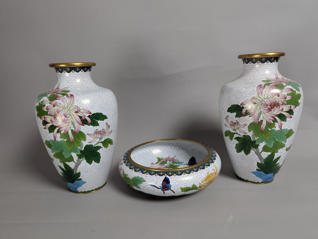 Elegant Chinese Cloisonne 3-Piece Garniture Set with Colorful Floral Motifs: **Important** Please read below description on how to avoid high shipping costs. Introducing a stunning matching three-piece garniture set featuring a pair of baluster-form vases and a central bowl, a