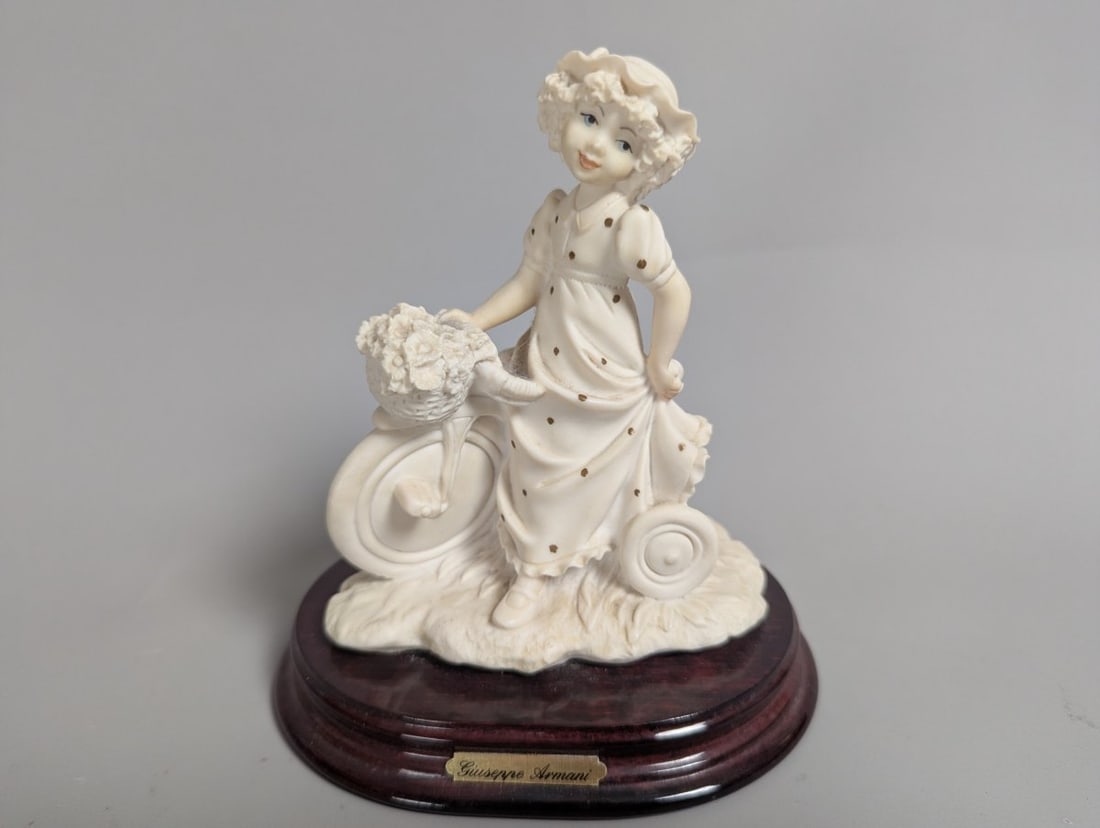 Giuseppe Armani Figurine Biking Around Art 0260-F Rare Collectible Piece: **Important** Please read below description on how to avoid high shipping costs. Discover the exquisite Giuseppe Armani Figurine 'Biking Around' (Art. 0260-F) standing 7 high x 6 x 4 1/2 in. This stun