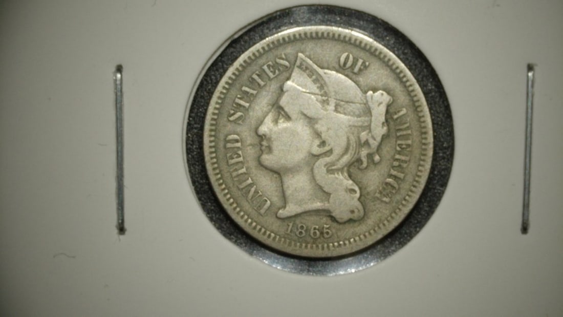 1865 United States Nickel Three-Cent Piece G by James Barton Longacre: **Important** Please read below description on how to avoid high shipping costs. Explore a remarkable piece of numismatic history with this 1865 Nickel Three-Cent piece, the first year this type of co