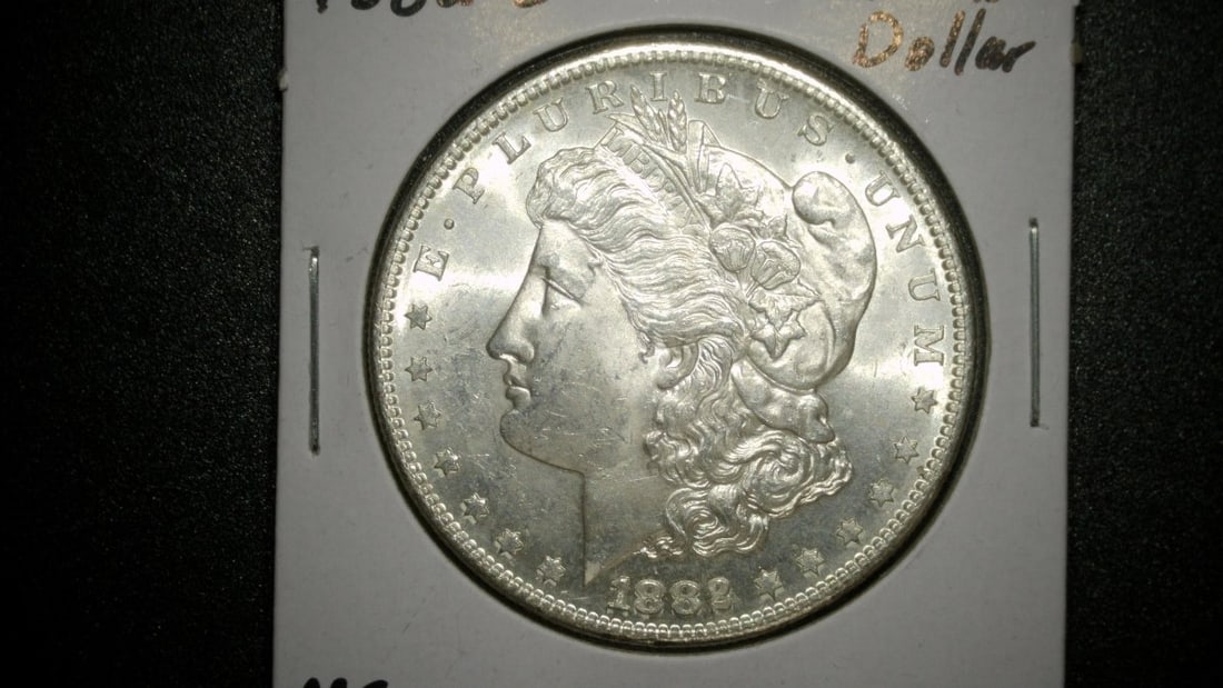 1882-S Morgan Silver Dollar Mint State George T. Morgan Collectible Coin: **Important** Please read below description on how to avoid high shipping costs. This is an 1882 Morgan Silver Dollar minted in San Francisco, identified by the 'S' mint mark. The coin is graded as