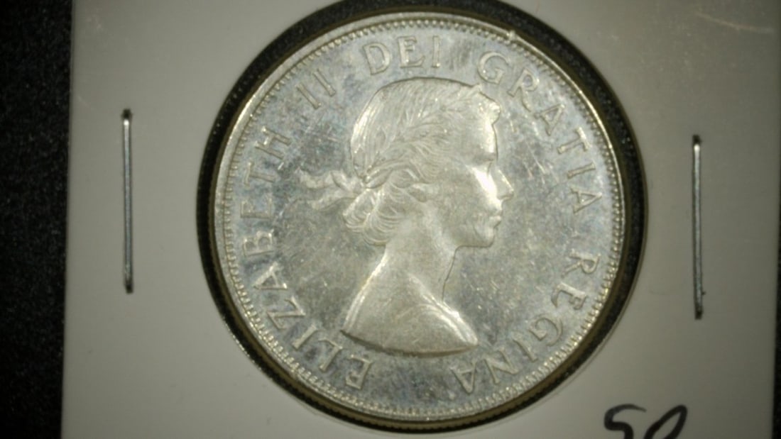 1964 Canada Silver 50 Cents Proof-like Coin - Royal Canadian Mint - Queen Elizabeth II: **Important** Please read below description on how to avoid high shipping costs. This exquisite 1964 Canada Silver 50 Cents coin features a stunning Proof-like finish that showcases a mirror-like
