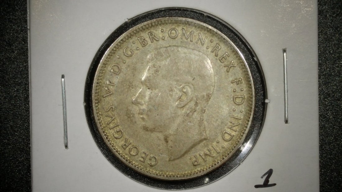 1944 Australia One Florin Coin King George VI Very Fine Silver T H Paget GEORGE KRUGER GRAY: **Important** Please read below description on how to avoid high shipping costs. This is a 1944 Australian One Florin coin featuring a portrait of King George VI on the obverse and the Australian