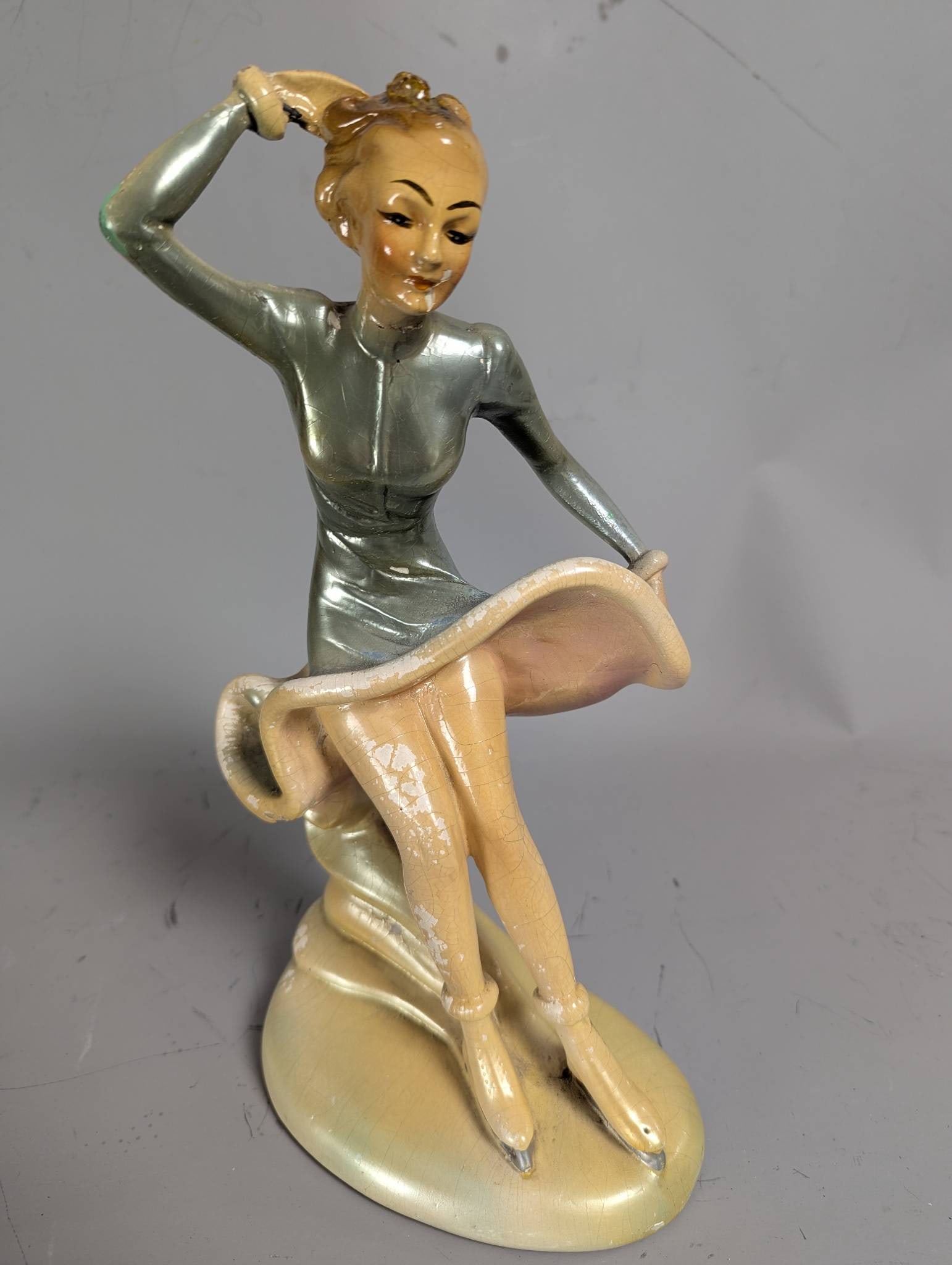 Plaster Art Deco Flapper Girl Figurine with Hand on Head and Raised Dress: **Important** Please read below description on how to avoid high shipping costs. Art Deco plaster figurine depicting a flapper girl sitting with one hand on her head and the other lifting her dress