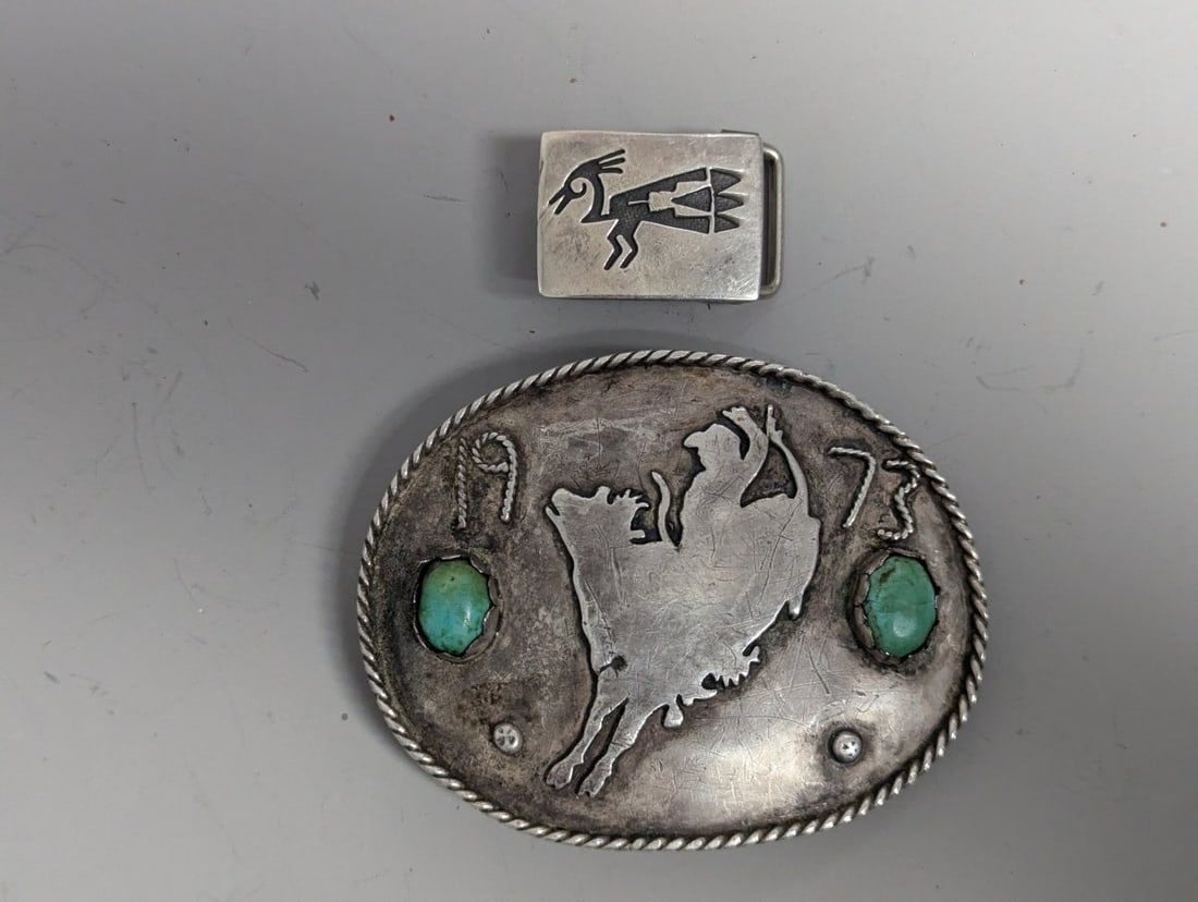 Vintage Southwestern Sterling Silver & Turquoise Buffalo & Hopi Overlay Belt Buckles Lot: **Important** Please read below description on how to avoid high shipping costs. Discover a unique collection of two vintage Southwestern-style belt buckles. The larger buckle, measuring 4 x 3 inches 