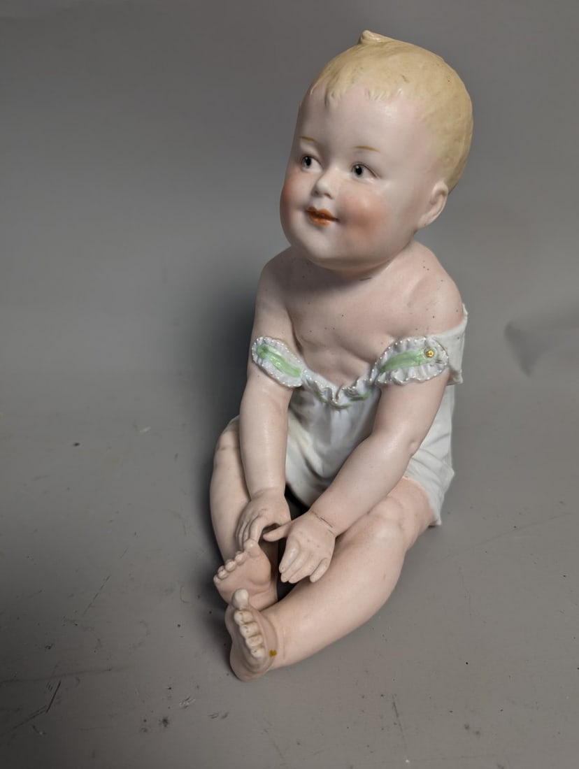 Antique German Bisque Porcelain Piano Baby Figurine by Gebruder Heubach: **Important** Please read below description on how to avoid high shipping costs. This exquisite Antique German Bisque Porcelain Piano Baby measures 8 1/2 high x 7 x 5 and stands as a stunning example