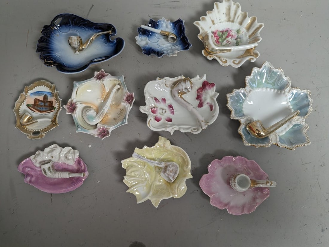 Vintage Porcelain Tobacco Pipe Rests Collection German Export 10 Distinct Decorative Pieces: **Important** Please read below description on how to avoid high shipping costs. Discover this exquisite collection of 10 vintage porcelain pipe rests, ranging from approximately 5 x 6 x 1 inches each