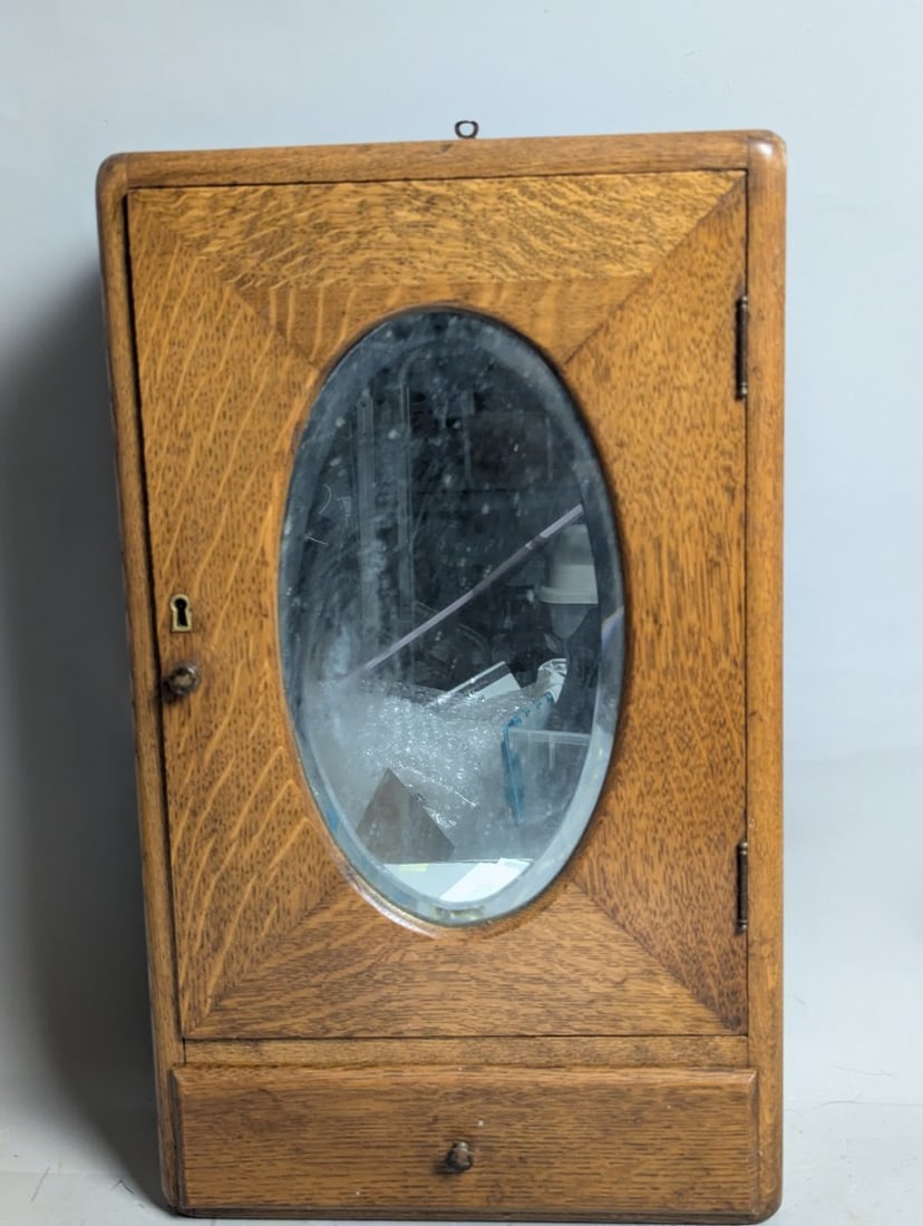 Antique Oak Medicine Cabinet with Oval Beveled Mirror Furniture Home Decor: **Important** Please read below description on how to avoid high shipping costs. Discover this stunning antique oak medicine cabinet, featuring an original oval beveled glass mirror. This cabinet