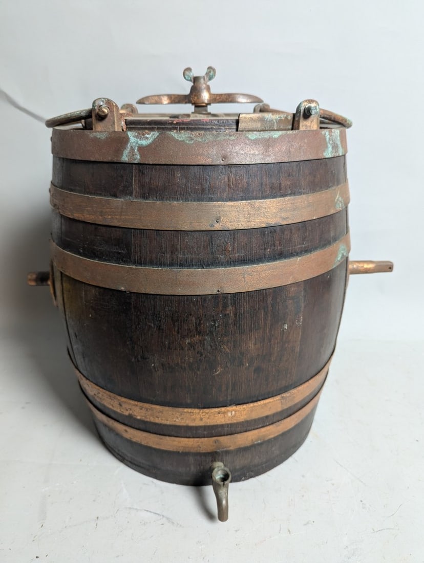 Antique Oak and Copper-Banded Water Barrel Scuttlebutt Nautical Collectible: **Important** Please read below description on how to avoid high shipping costs. This stunning antique oak and copper-banded water barrel, known as a scuttlebutt, stands 19 inches high, measures 24