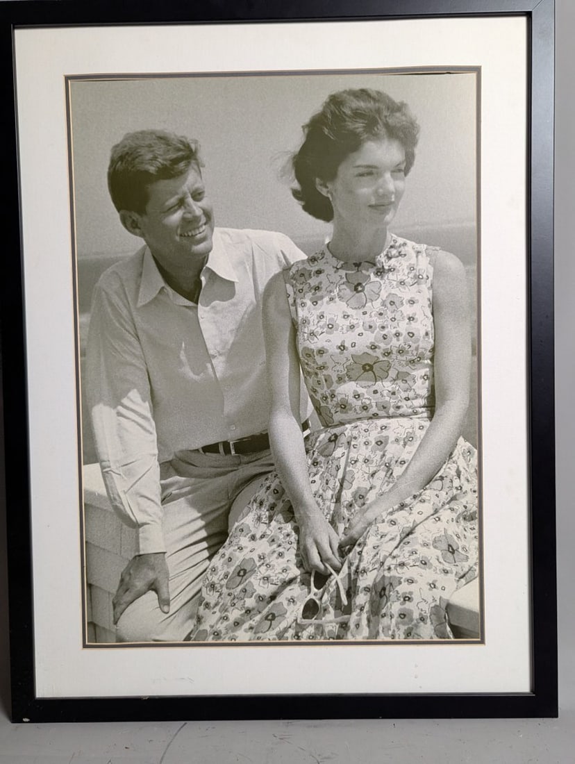 Framed Reproduction Photograph of John F Kennedy and Jacqueline Bouvier by Hy Peskin: **Important** Please read below description on how to avoid high shipping costs. Preview this iconic reproduction photograph featuring John F. Kennedy and Jacqueline Bouvier, captured by renowned