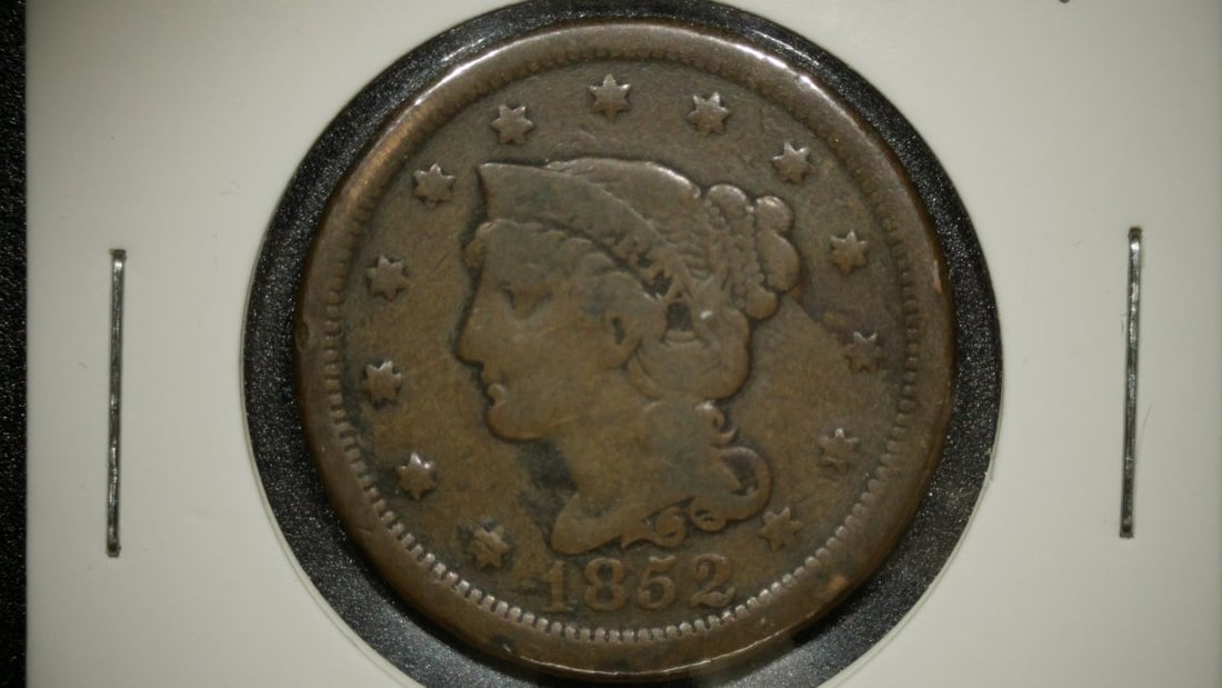 1852 Braided Hair Large Cent V.F. by Christian Gobrecht - Collectible US Coin: **Important** Please read below description on how to avoid high shipping costs. This is an 1852 Braided Hair Large Cent, a one-cent piece minted by the United States Mint. The obverse features the he