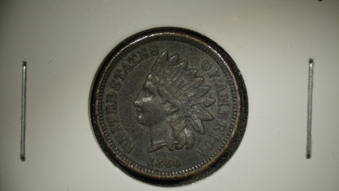 1860 Indian Head Cent Very Fine VF Coin by James Barton Longacre: **Important** Please read below description on how to avoid high shipping costs. This listing features a beautifully preserved 1860 Indian Head Cent, graded Very Fine (VF). This coin exhibits moderate