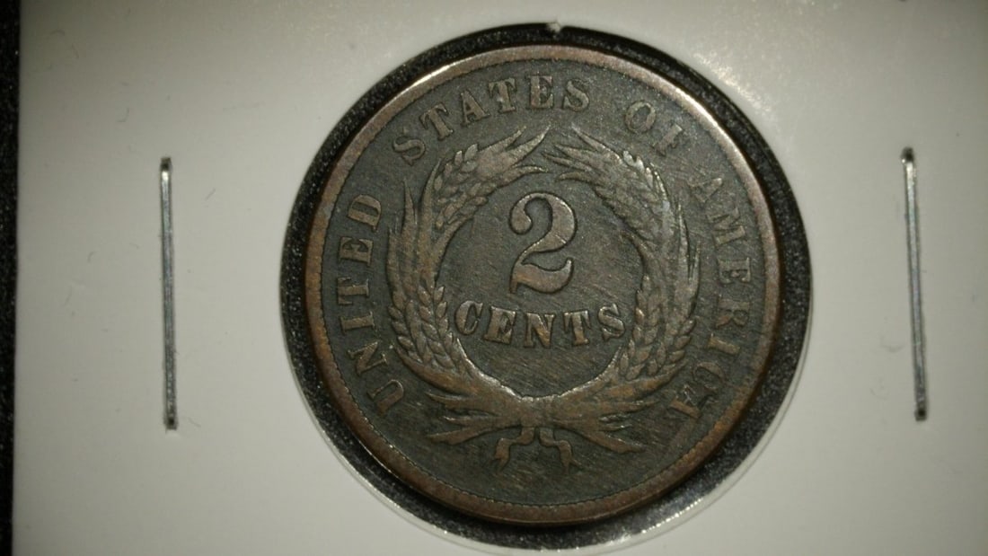 1864 United States Two Cent Piece F. Holed Historical Coin Collector Item: **Important** Please read below description on how to avoid high shipping costs. This is an 1864 United States Two Cent Piece, the first coin to feature the motto 'IN GOD WE TRUST'. This coin is grade