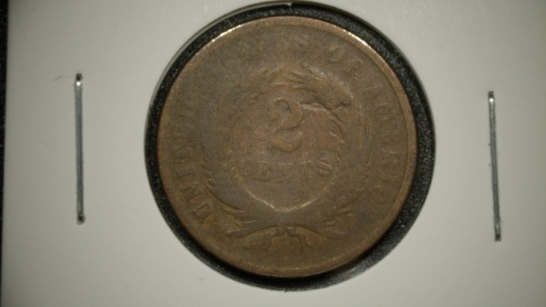 1867 United States Two Cent Piece Good by James Barton Longacre: **Important** Please read below description on how to avoid high shipping costs. Up for auction is a historically significant 1867 United States Two Cent Piece, graded as Good. This coin, designed by 