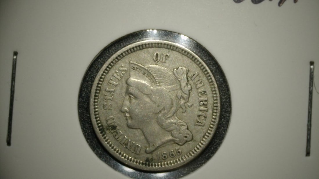1865 Three-Cent Nickel VF by James B. Longacre - Popular Collectible Coin: **Important** Please read below description on how to avoid high shipping costs. This is an exceptional 1865 Three-Cent Nickel, professionally graded as Very Fine (VF). This coin, designed by the