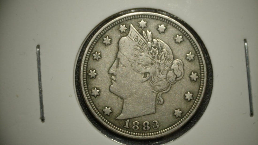1883 Liberty Head V Nickel No CENTS F. S by Charles E. Barber Coin: **Important** Please read below description on how to avoid high shipping costs. This is an 1883 Liberty Head 'V' Nickel, the first year of issue for this design. It is the 'No CENTS' variety,
