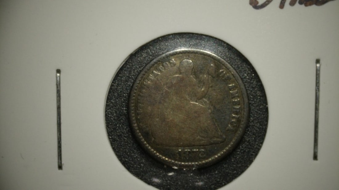1872 Seated Liberty Half Dime Christian Gobrecht About Good AG Silver Coin: **Important** Please read below description on how to avoid high shipping costs. This auction features a 1872 Seated Liberty Half Dime, graded as About Good (AG). The coin displays significant wear