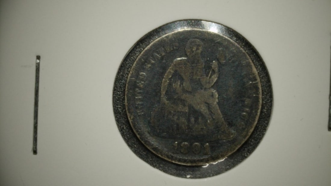 1891 Seated Liberty Dime Good G by Christian Gobrecht 90% Silver Collectible Coin: **Important** Please read below description on how to avoid high shipping costs. This is an 1891 Seated Liberty Dime with a grade of Good (G). The Seated Liberty design was used on the dime from 1837 
