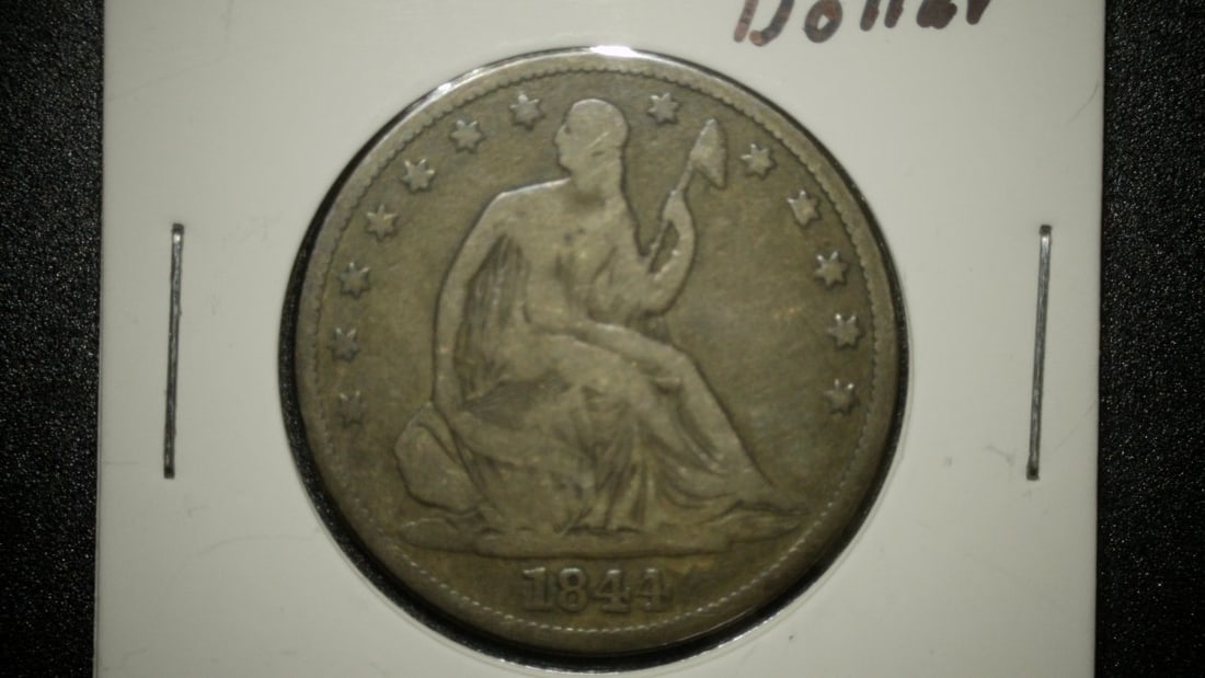 1844 Seated Liberty Half Dollar Fine by Christian Gobrecht Collectible Silver Coin: **Important** Please read below description on how to avoid high shipping costs. This is an 1844 Seated Liberty Half Dollar, designed by Christian Gobrecht. The obverse features the figure of Liberty