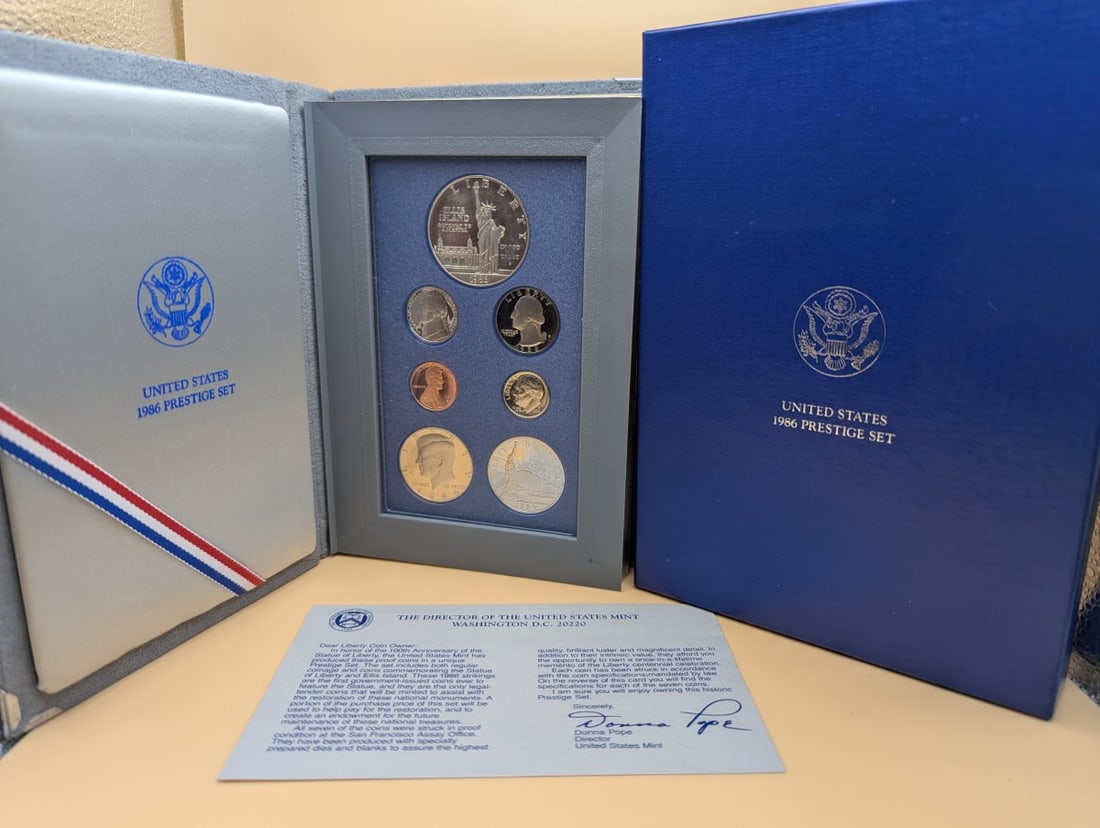 1986 United States Mint Liberty Prestige Proof Set with Silver Dollar - Gem Quality: **Important** Please read below description on how to avoid high shipping costs. Discover a remarkable piece of history with the complete United States 1986 Liberty Prestige Proof Set, featuring origi