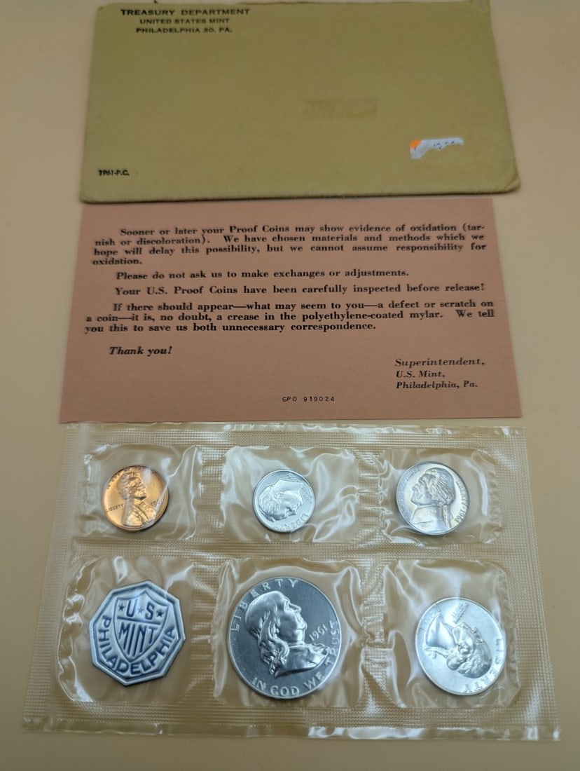 1961 U.S. Mint Silver Proof Set - 90% Silver Coins - Original Government Packaging: **Important** Please read below description on how to avoid high shipping costs. Discover a complete 1961 U.S. Mint Silver Proof Set featuring five coins including a Lincoln Cent, Jefferson Nickel, an
