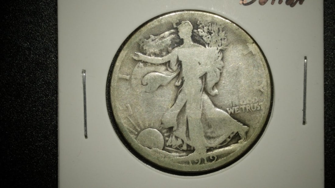 1919-D Walking Liberty Half Dollar AG by Adolph A. Weinman - Key Date Coin: **Important** Please read below description on how to avoid high shipping costs. This 1919-D Walking Liberty Half Dollar, designed by renowned artist Adolph A. Weinman, is a remarkable piece for
