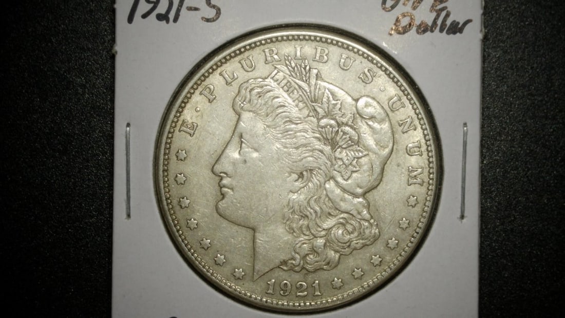 1921-S Morgan Silver Dollar Set - V.F. and A.U. Grades - George T. Morgan Design: **Important** Please read below description on how to avoid high shipping costs. This auction features a stunning set of two 1921-S Morgan Silver Dollars, capturing the essence of American numismatic