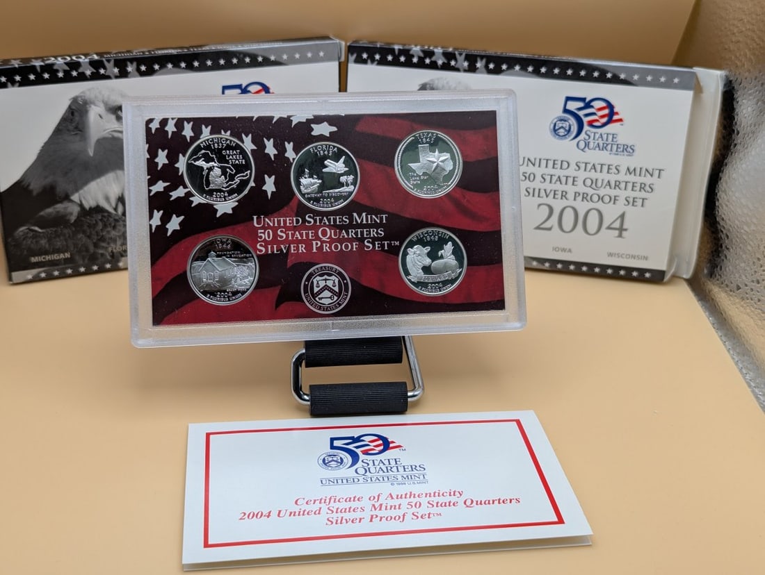 Lot of 2 2004-S United States Mint 50 State Quarters Silver Proof Sets Mint: **Important** Please read below description on how to avoid high shipping costs. This lot includes two complete 2004-S United States Mint 50 State Quarters 90% Silver Proof Sets. Each set features fiv