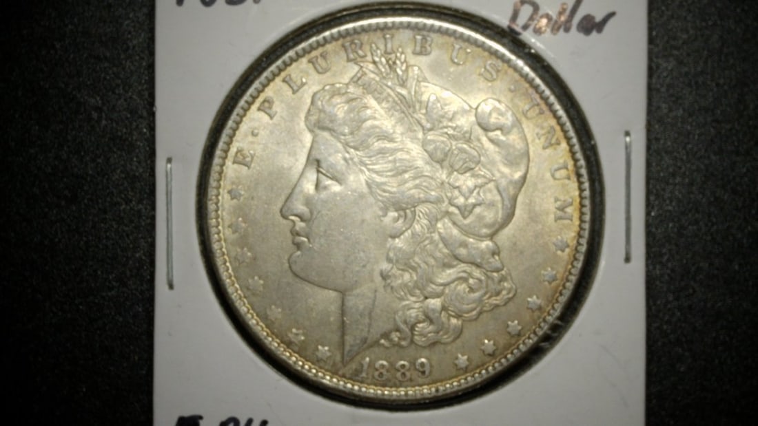1889-P Morgan Silver Dollar A.U. George T. Morgan Designed Coin: **Important** Please read below description on how to avoid high shipping costs. This stunning 1889-P Morgan Silver Dollar is a must-have for any coin collector. Graded as About Uncirculated (A.U.),