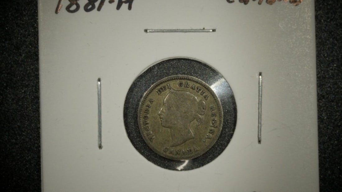 1881-H Canada 5 Cents Silver Coin Very Good Heaton Mint Victoria Portrait: **Important** Please read below description on how to avoid high shipping costs. This is an 1881-H Canada 5 Cents silver coin featuring the portrait of Queen Victoria. Struck at the Heaton Mint, this