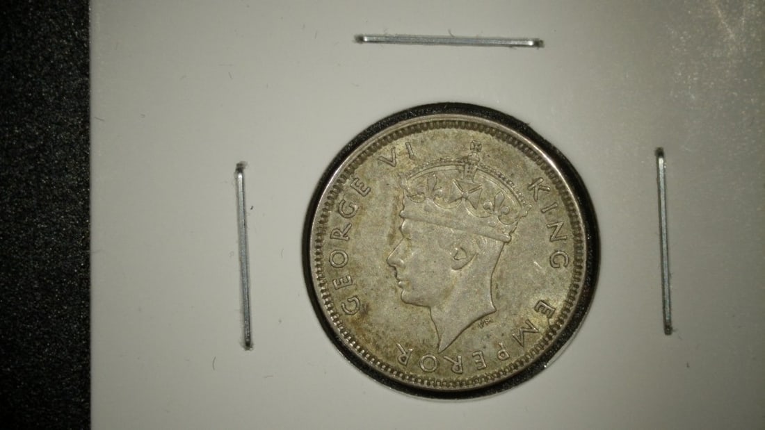 1942-S Fiji Sixpence Silver Coin - King George VI - Very Fine Condition: **Important** Please read below description on how to avoid high shipping costs. Here is a stunning 1942-S Fiji Sixpence featuring the obverse portrait of King George VI and the beloved turtle design 